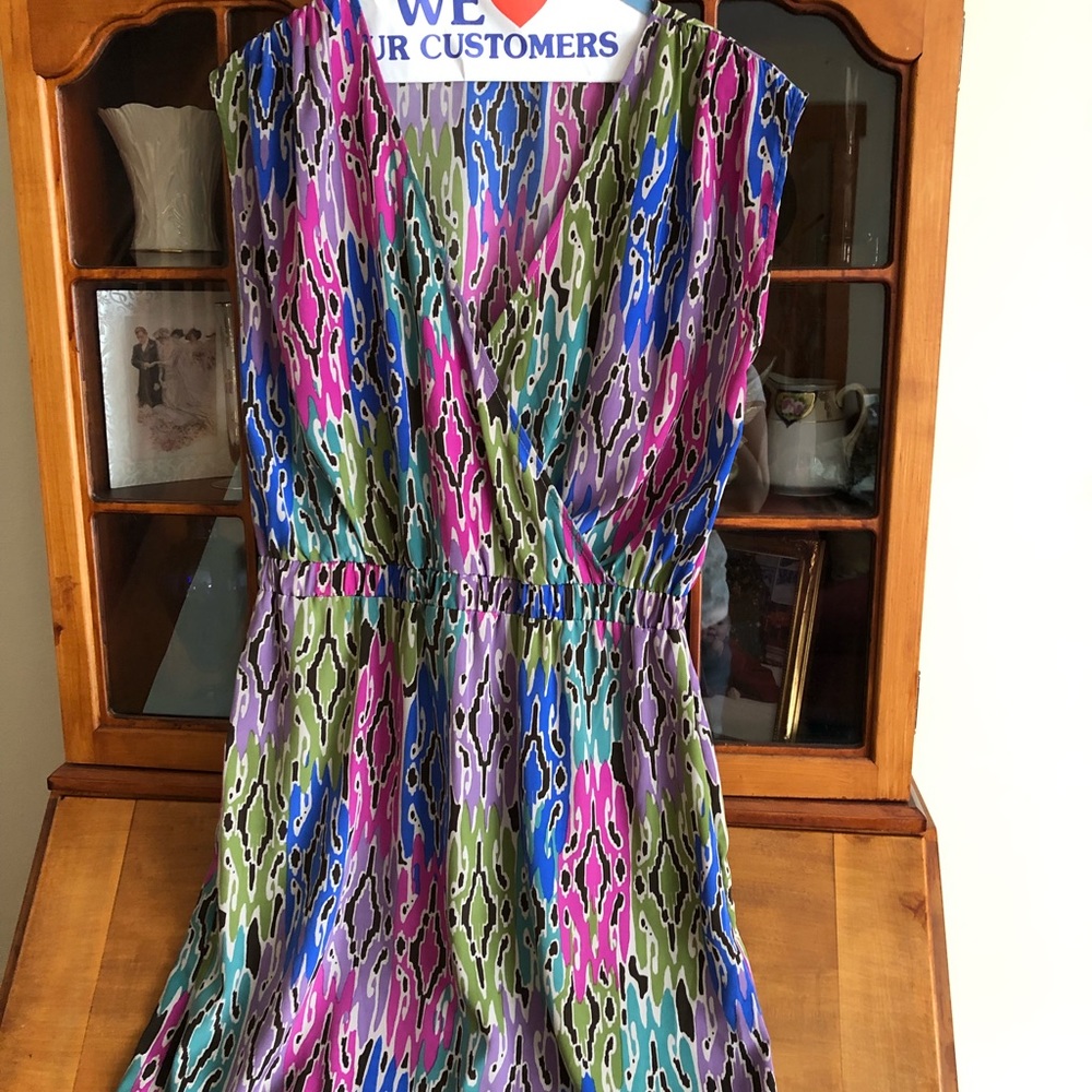 V-Neck bright patterned dress with cinch waist.